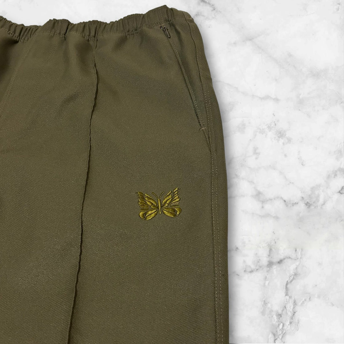 NEEDLES WARM UP PANTS OLIVE